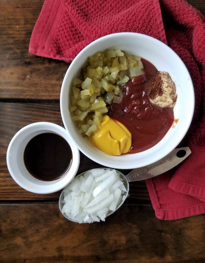 ketchup, mustard, pickles, garlic powder & chipotle in large bowl, onions in measuring cup & Worcestershire in small bowl