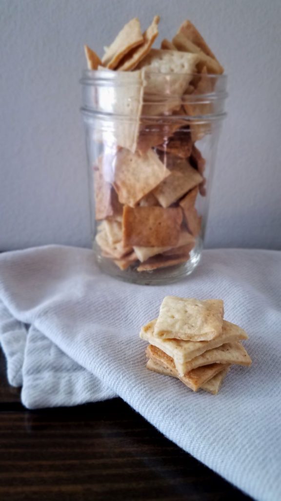 stack of sourdough cracker and jar full of crackers
