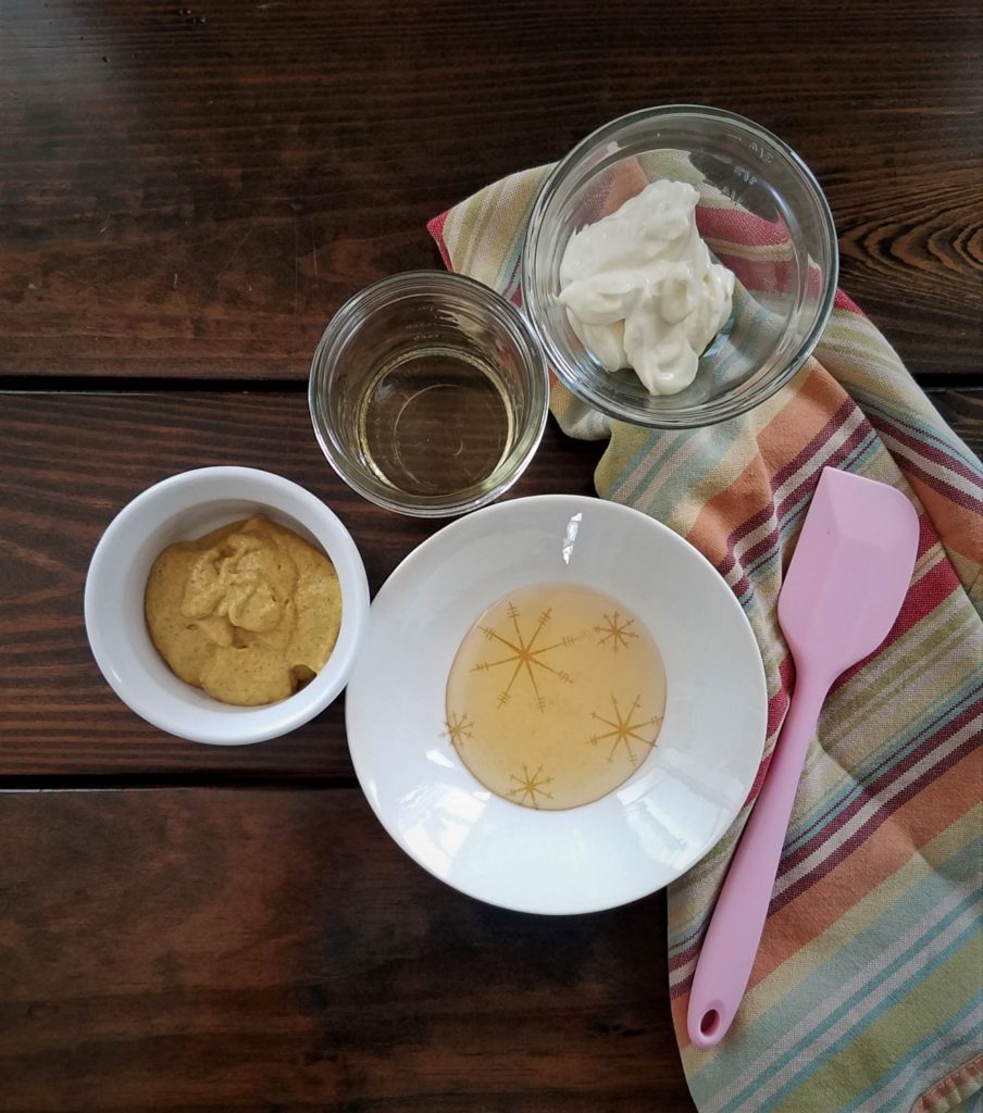 ingredients for creamy coleslaw dressing various bowl with pink spatula