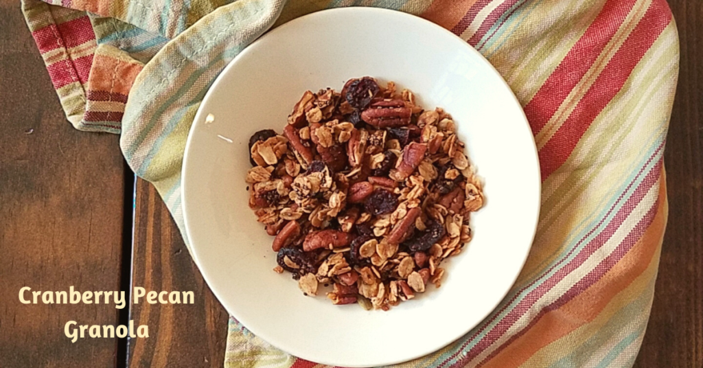 Cranberry Pecan Granola in bowl on striped towel