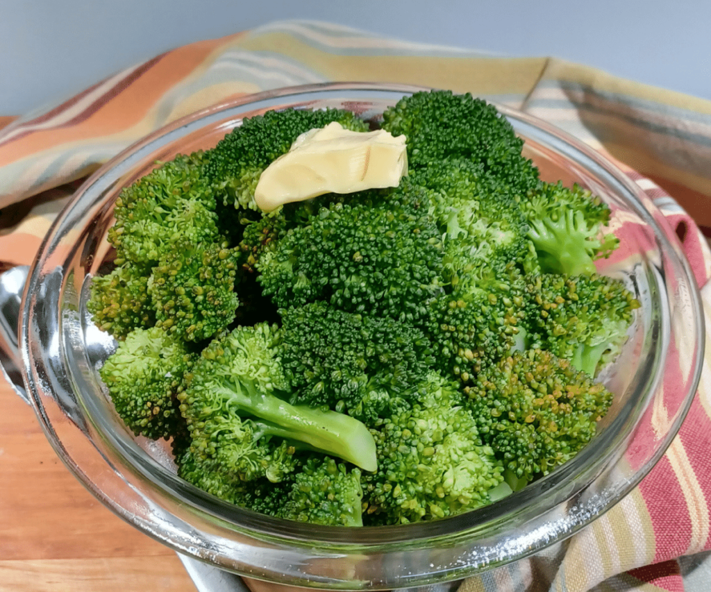 Instant pot steamed vegetables in bowl with butter on top