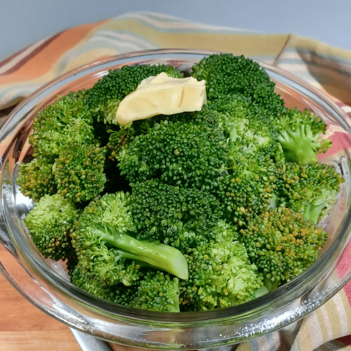 Instant pot steamed vegetables in bowl with butter on top