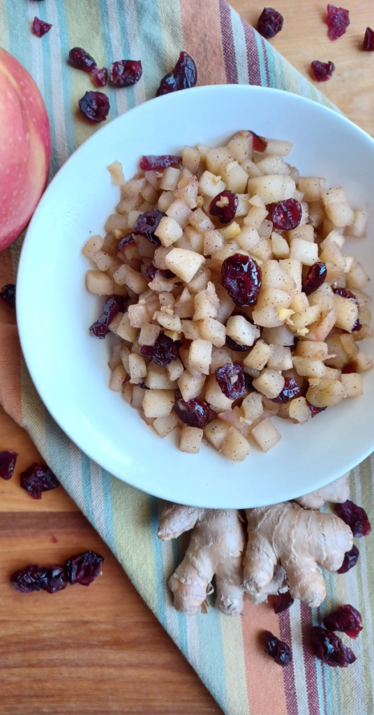 Apple Chutney in bowl on striped towel with ingredients surrounding