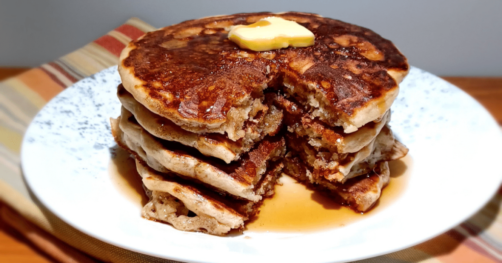 Cut stack of sourdough pancakes on plate