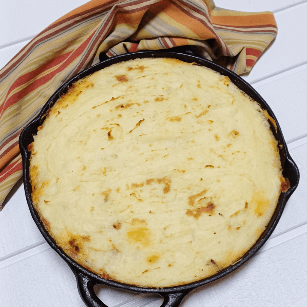 baked cottage pie in cast iron skillet