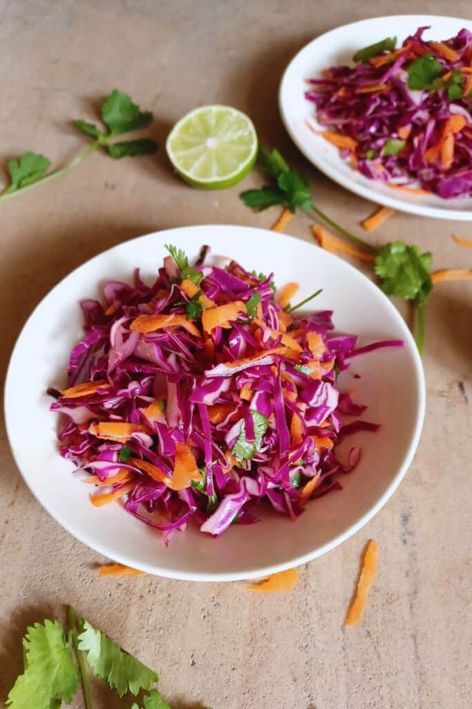 Small bowls filled with cilantro lime slaw