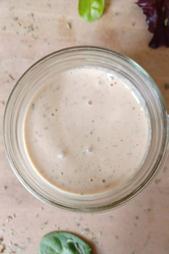 Creamy Italian dressing in a wide mouth mason jar