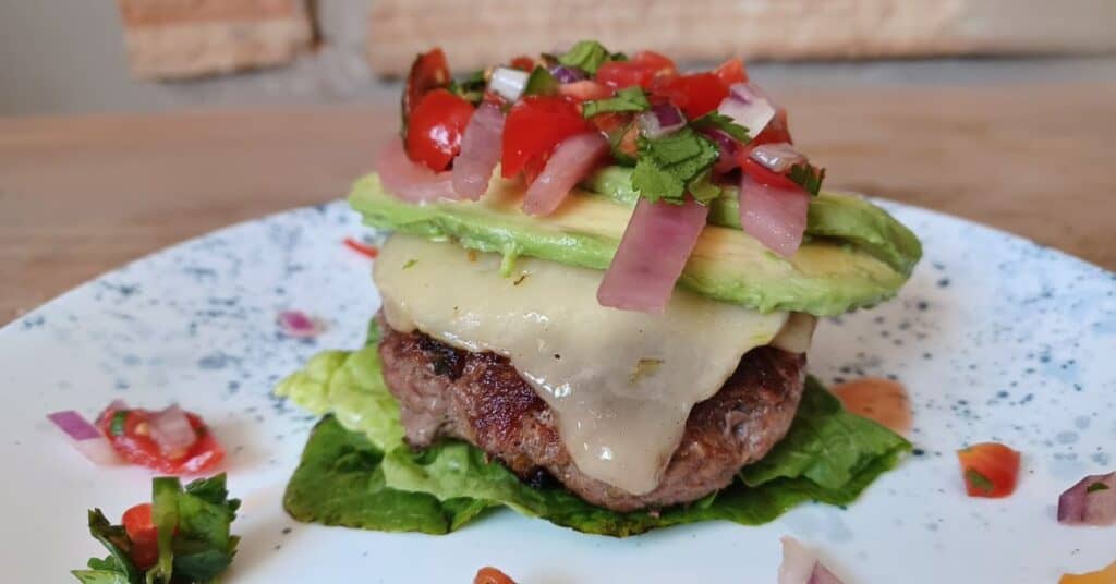 Salsa burger topped with pepper jack cheese and avocado